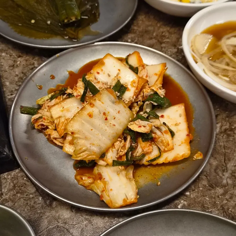 Scallions and king oyster mushrooms served with nanchuk matdon