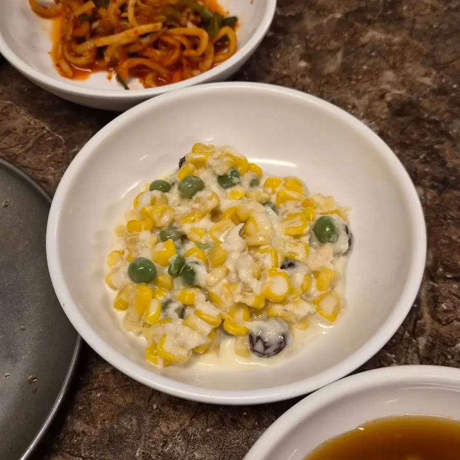 Close-up of accompanying side dishes at Pork80