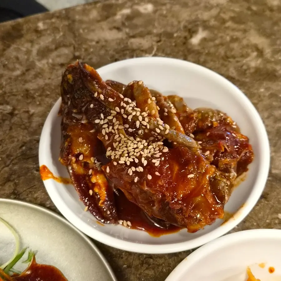 Seasoned raw crab served as a side dish