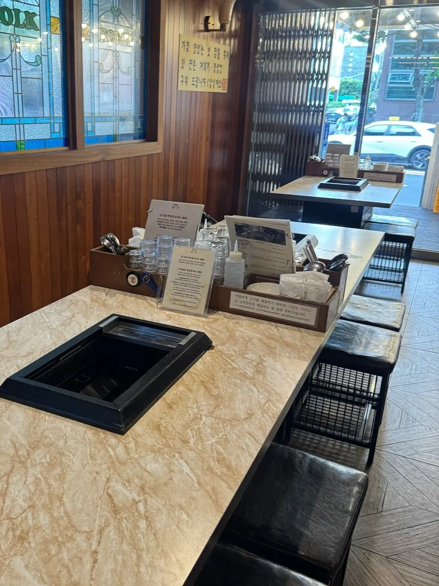 Interior of Pork80 Jeju Airport Branch with wide tables