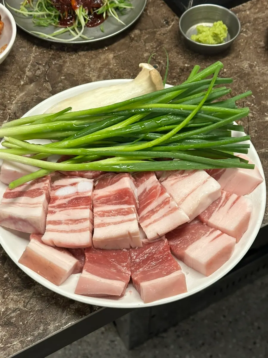 Side dish plate with scallion shreds and corn salad