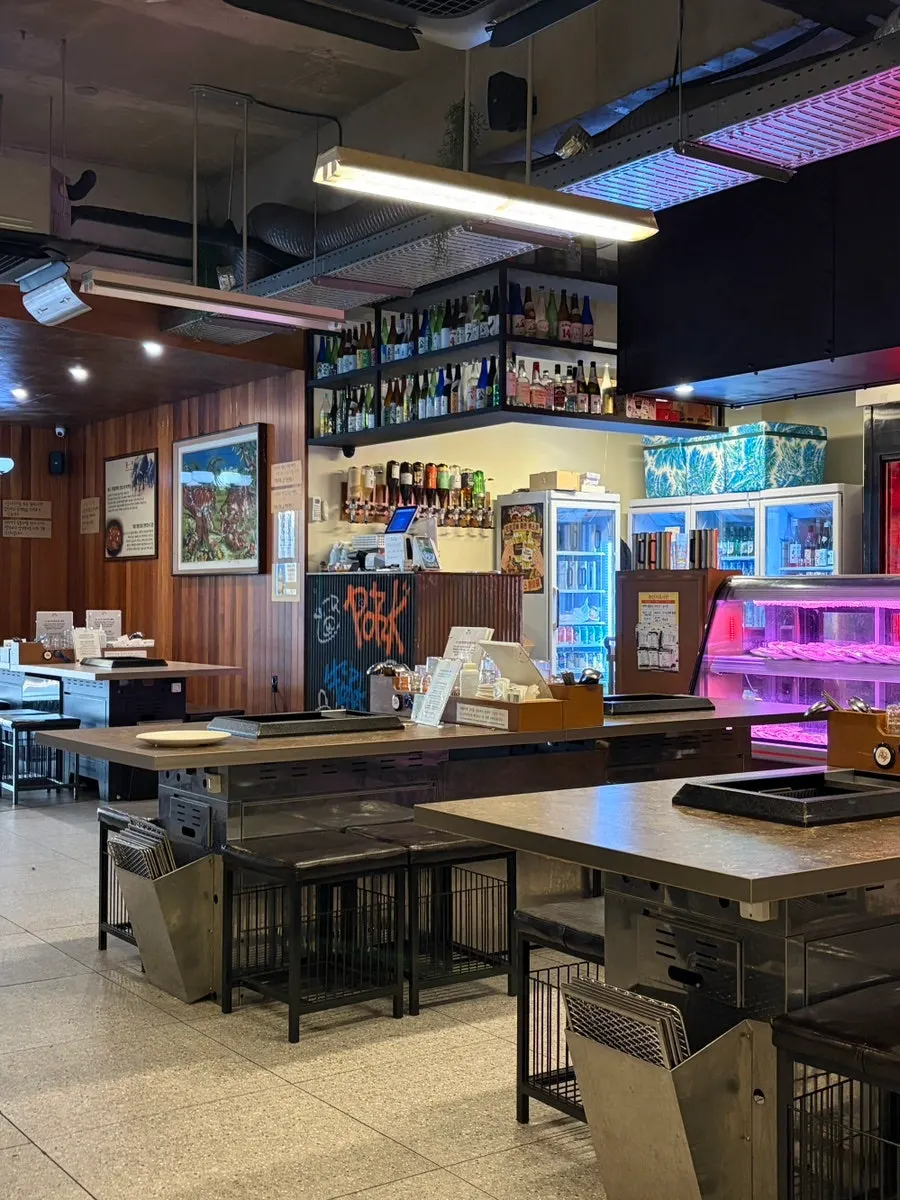 Retro interior seating at Pork80 Jeju Airport Branch