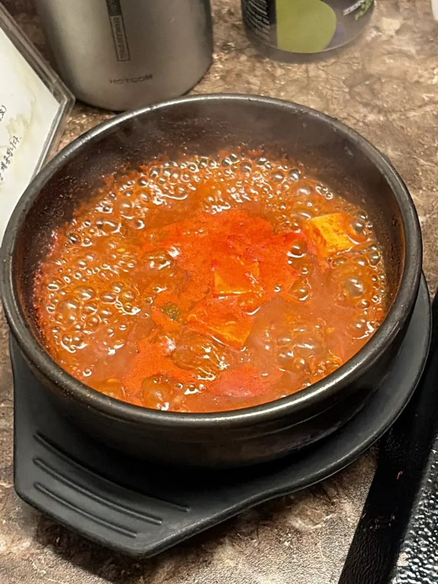 Jeju-style mel-jorim and sauces served in a stone bowl