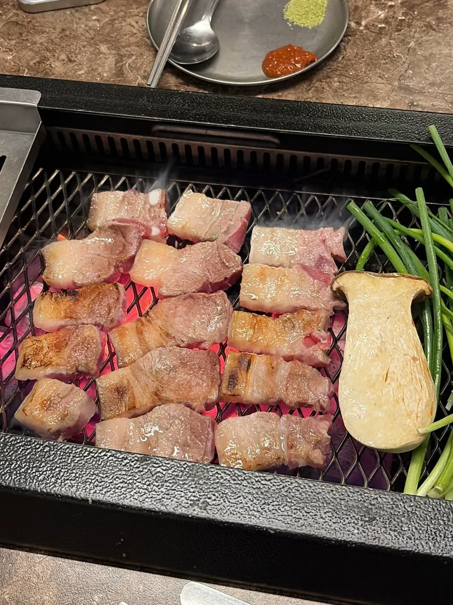 Thick nanchuk matdon black pork on the charcoal grill