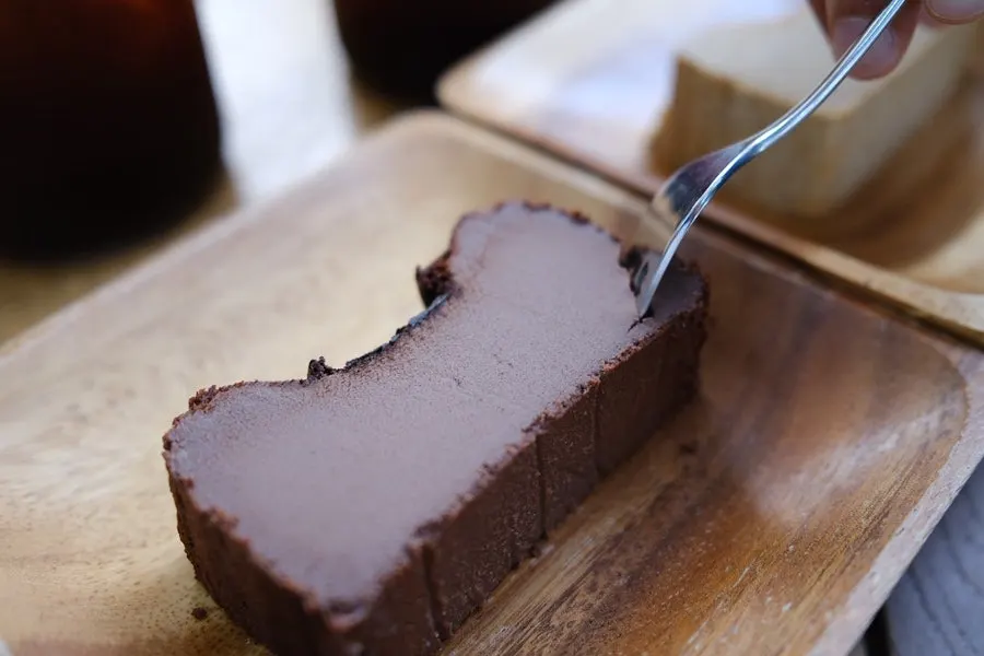 A slice of dense chocolate Basque cheesecake