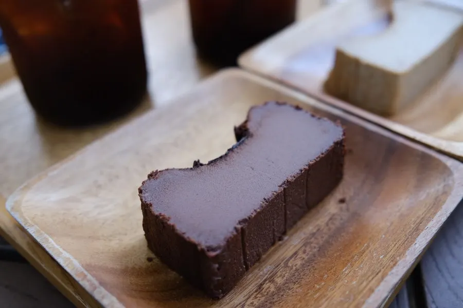 Two slices of chocolate and Earl Grey Basque cheesecake