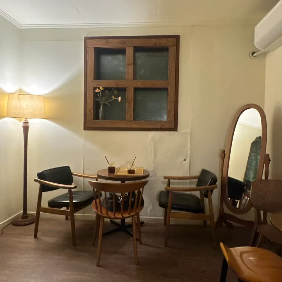 Seat with a forest view through floor-to-ceiling windows