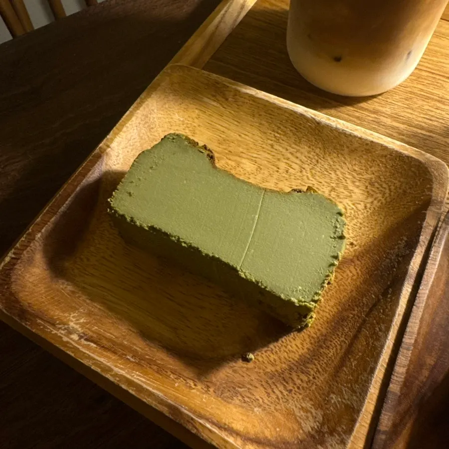 A slice of matcha Basque cheesecake