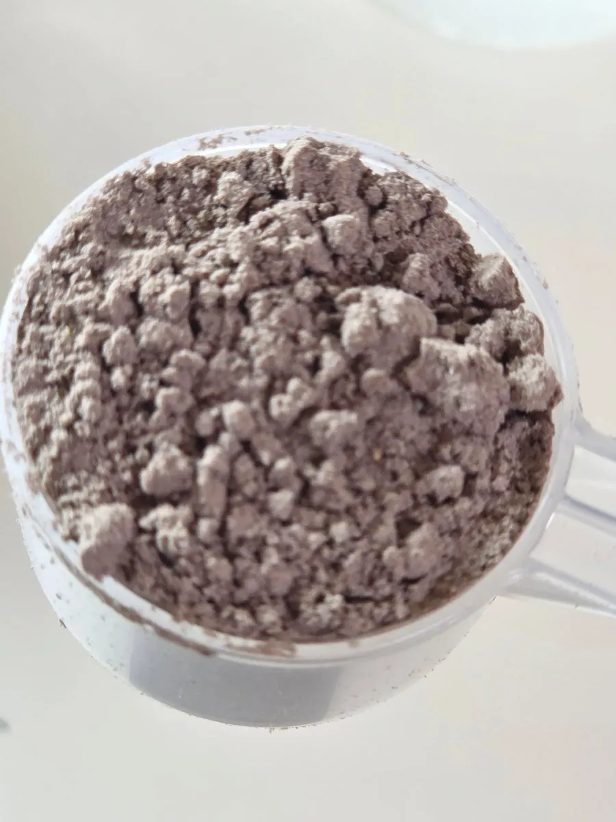 Chocolate-colored powder in a zipper-bag pouch