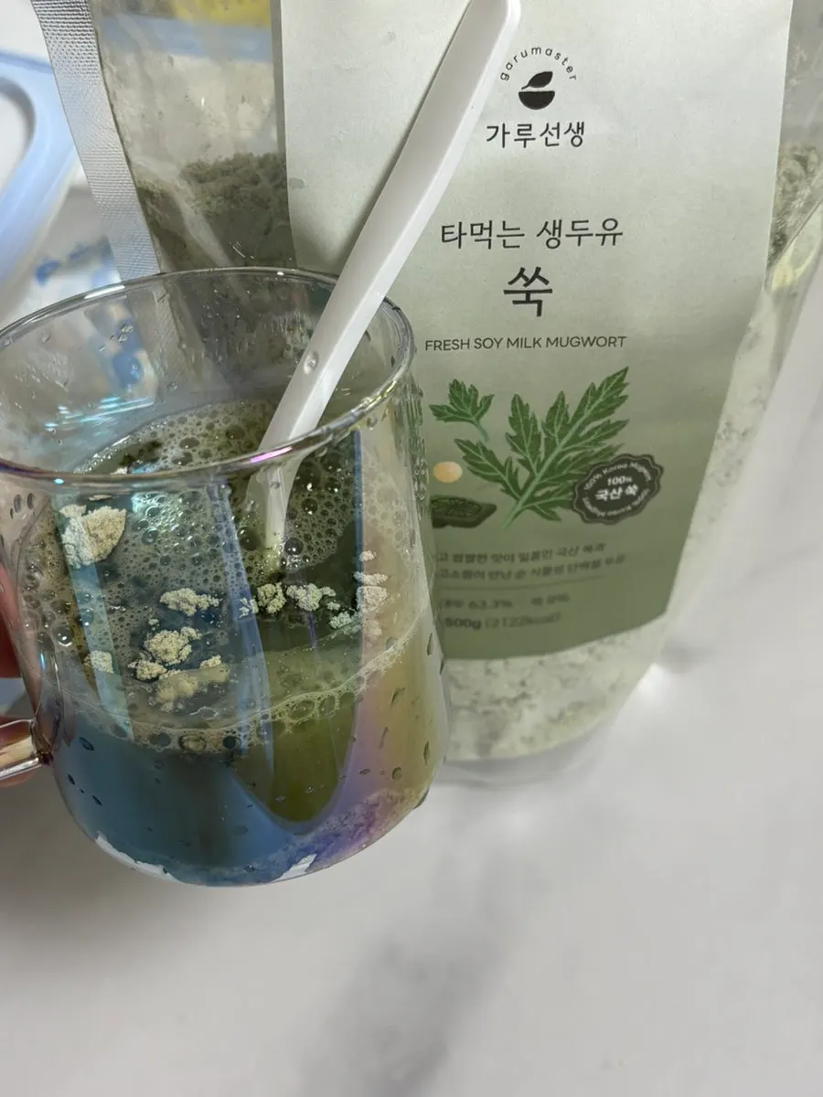 A cup of mugwort soy milk mixed with cold water