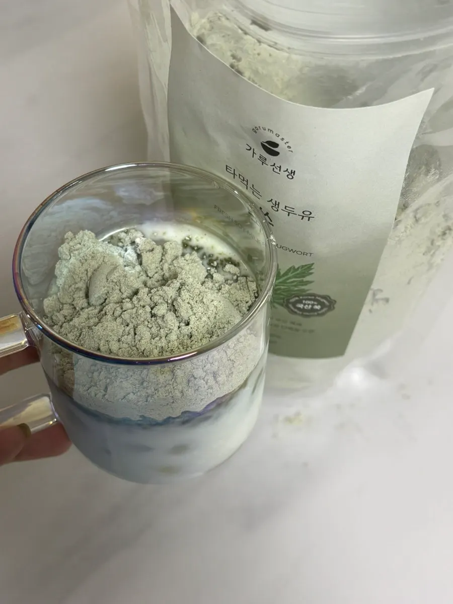 Scooping the powder out with the dedicated spoon