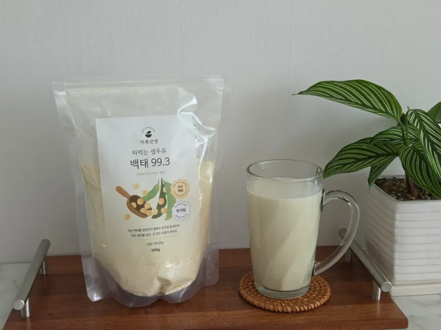 Scooping out baektae soybean powder with the dedicated scoop