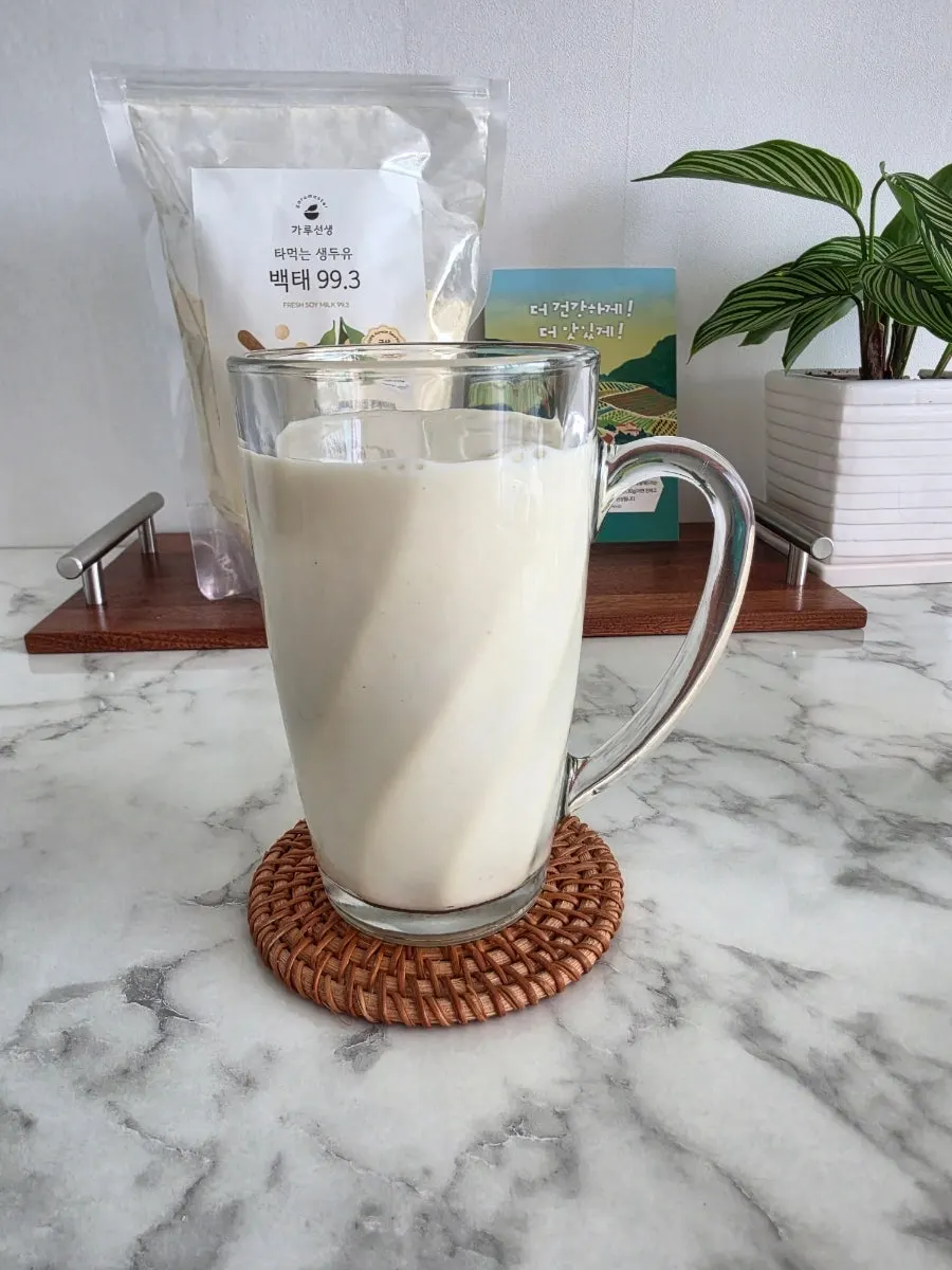 A finished cup of unsweetened soy milk mixed with water