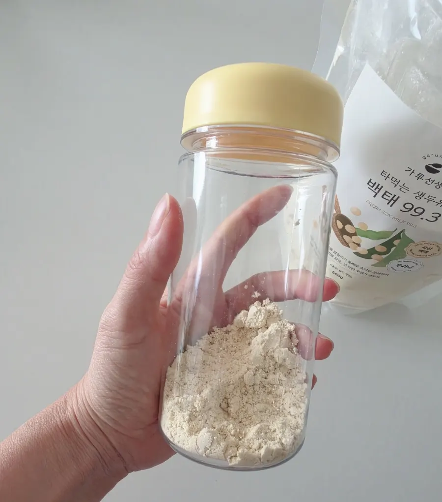 A cup of raw soy milk mixed before a morning hike