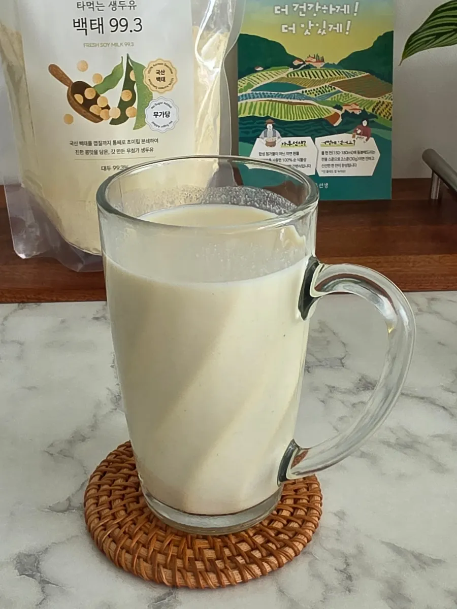 Two scoops of soy milk powder packed into a container for going out