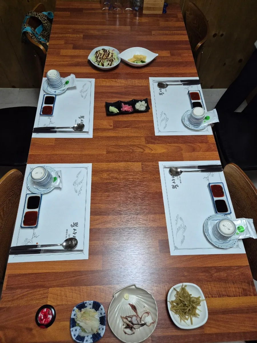 Basic table setting of salad and egg roll