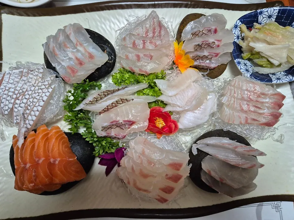 Garlic stems served alongside the sashimi