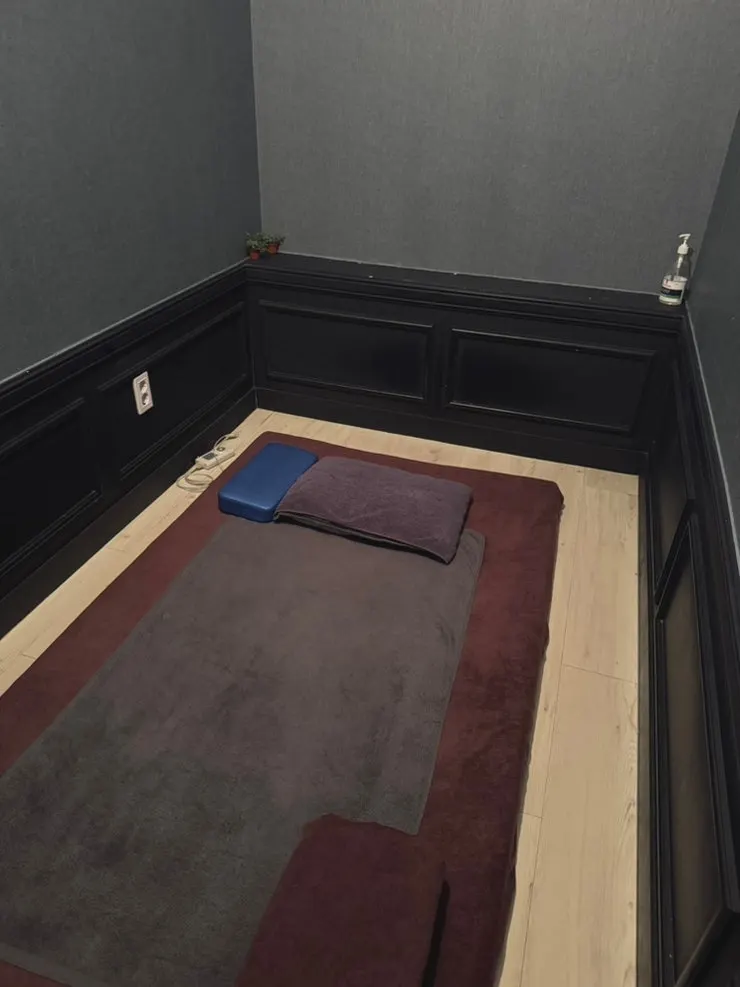 Massage room set up with robe and disposable underwear