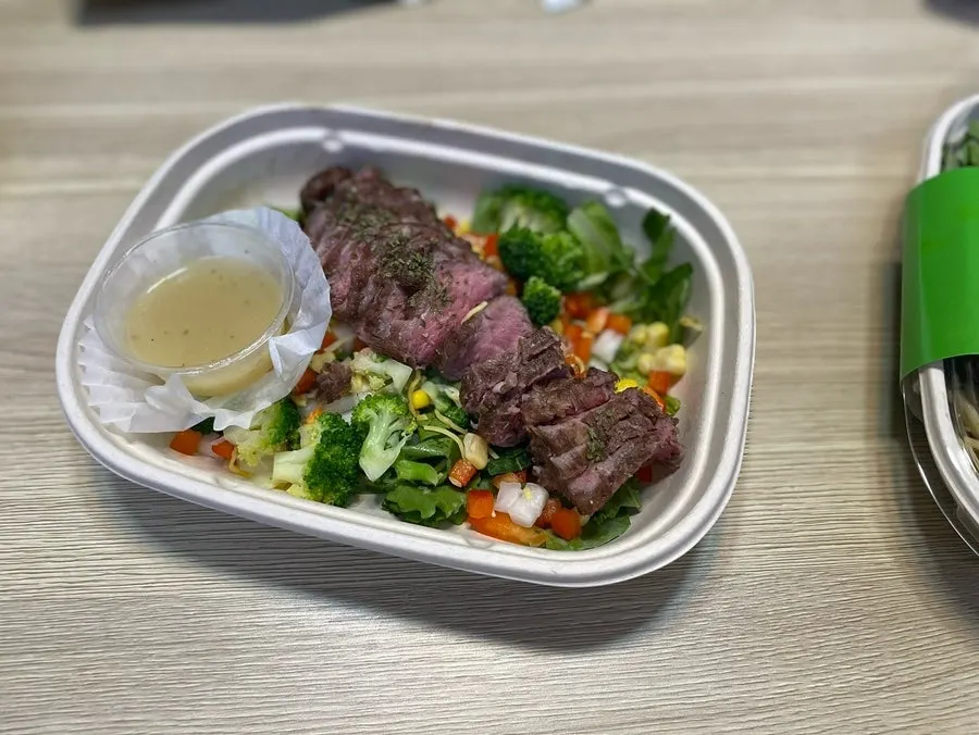 Opened lid revealing the beef cobb plate combo