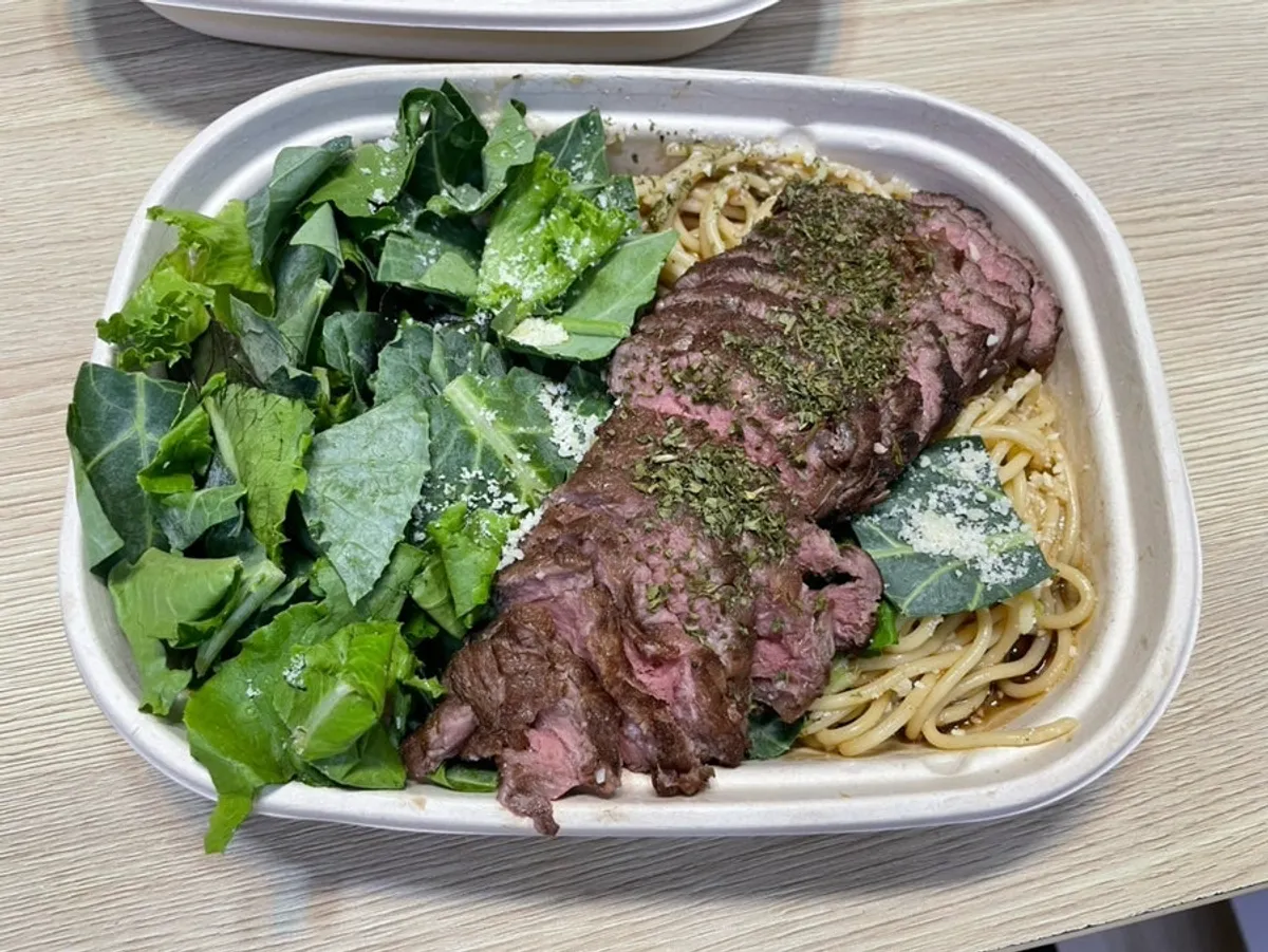 Cobb plate with plenty of broccoli and other vegetables, plus lemon garlic sauce