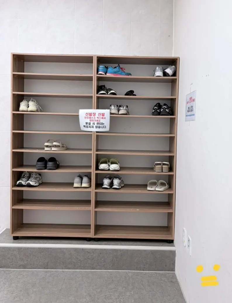 Locker room with rows of cabinets, separated by gender
