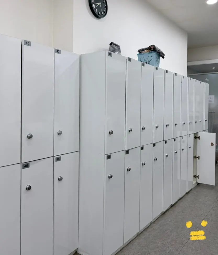 Locker room area with wide aisles between the cabinets
