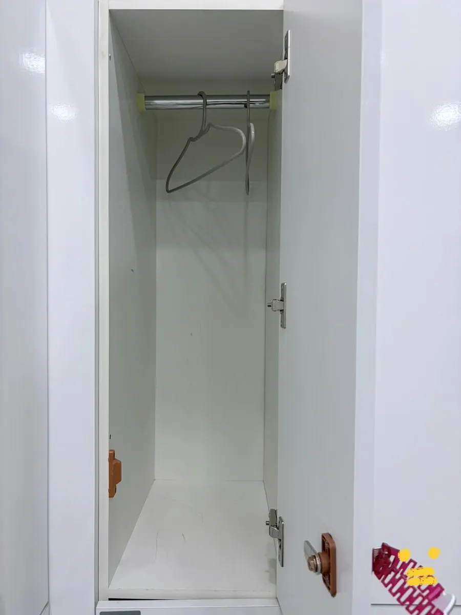 Inside a locker with a clothes hanger