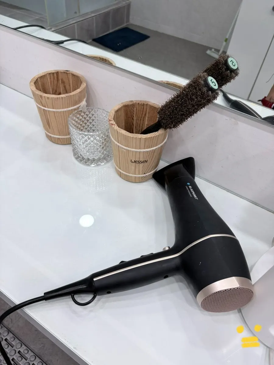 Grooming area with hair dryers and combs