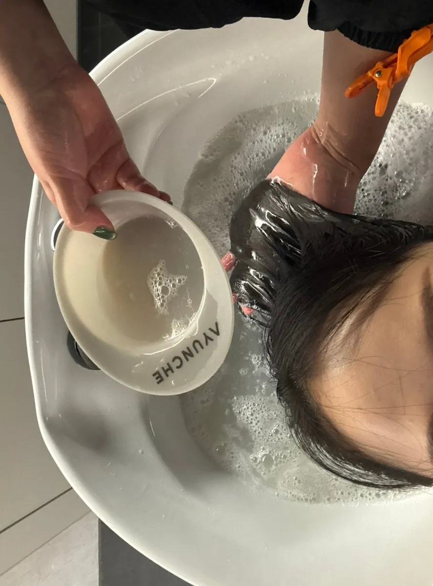 Project Lure shampoo room with a neck cushion