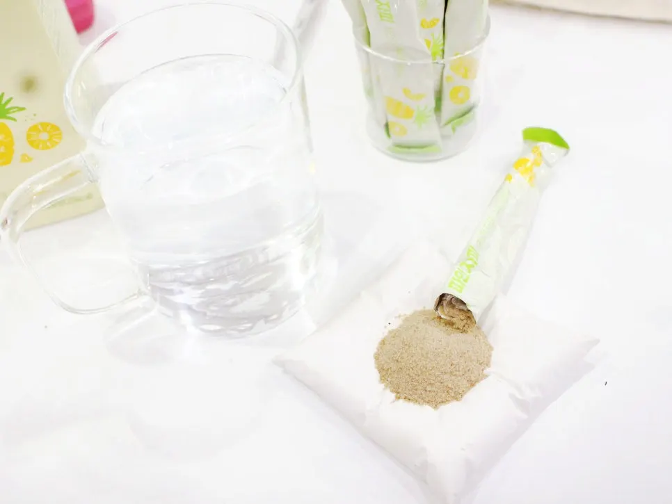 Beige psyllium husk powder taken out of an opened stick