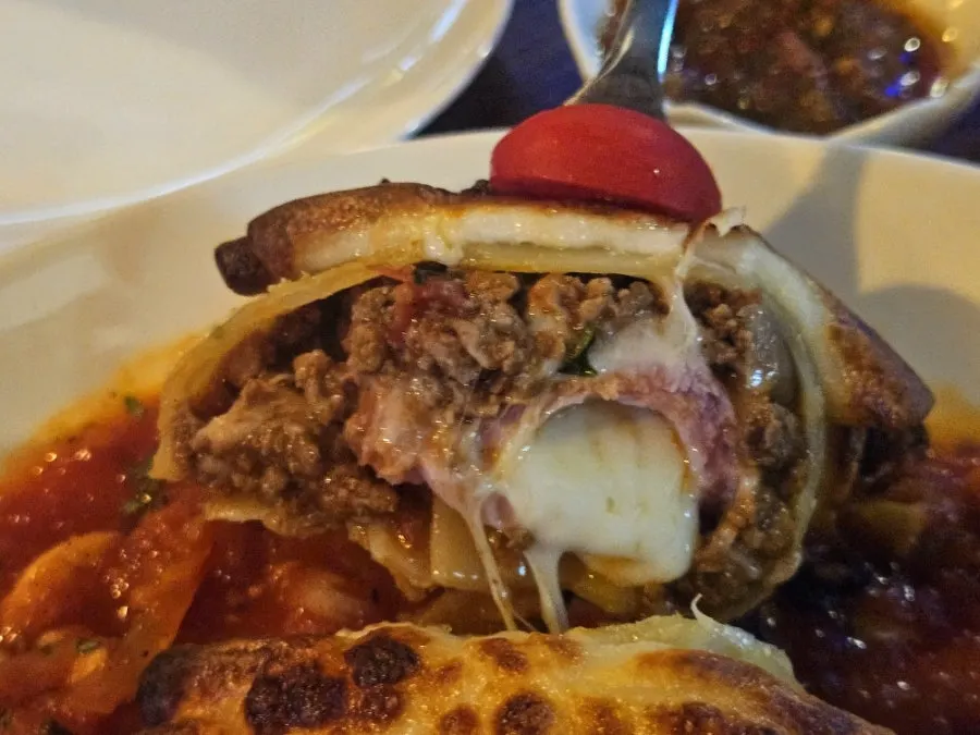 Cross-section of beef roll lasagna cut with scissors