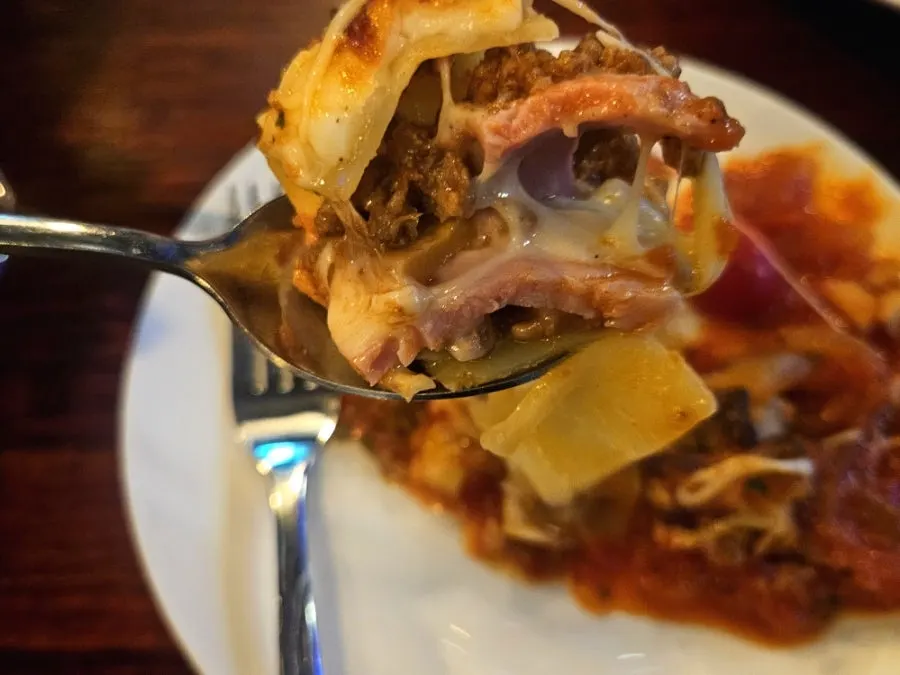 Inside of the lasagna showing beef ragu sauce