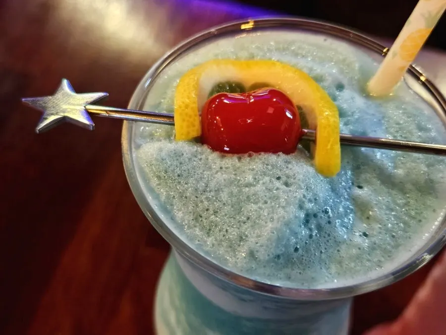 A glass of blue Blue Hawaiian cocktail