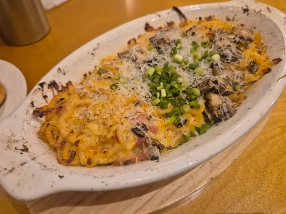 Half-and-half pizza loaded with fig jambon beurre and corn double bacon toppings