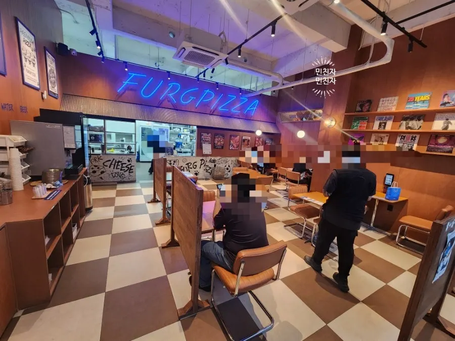 Interior of Pug Pizza House Sillim Branch with customers on a weekday evening