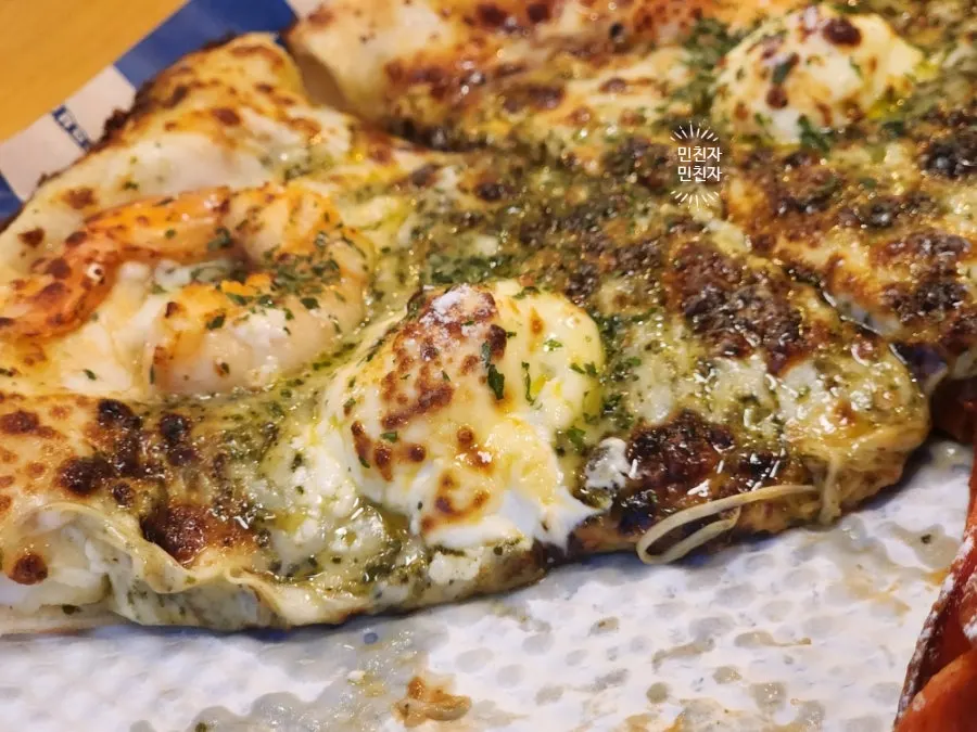 Half of the basil mascarpone shrimp pizza