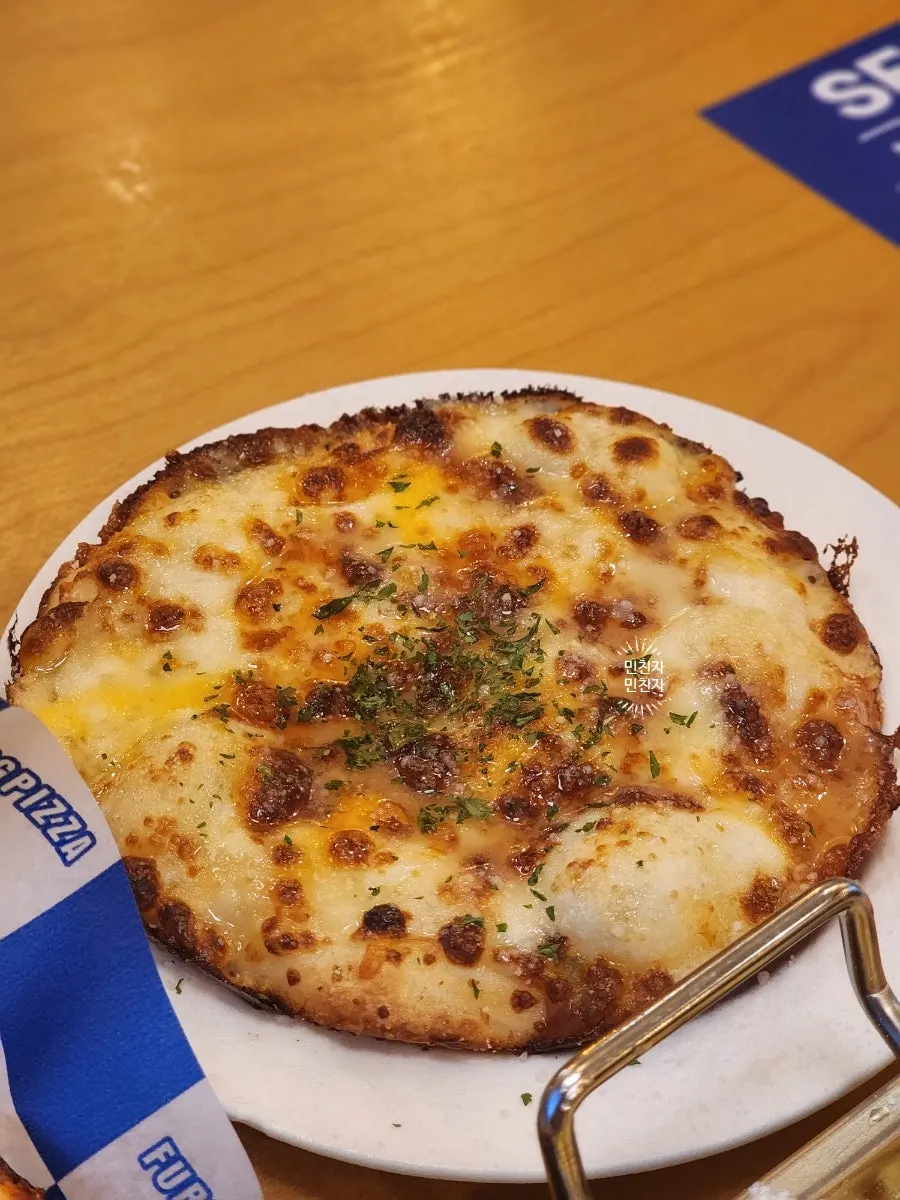 Pizza menu listing truffle mushroom gnocchi and pollack roe grilled beef brisket pizza