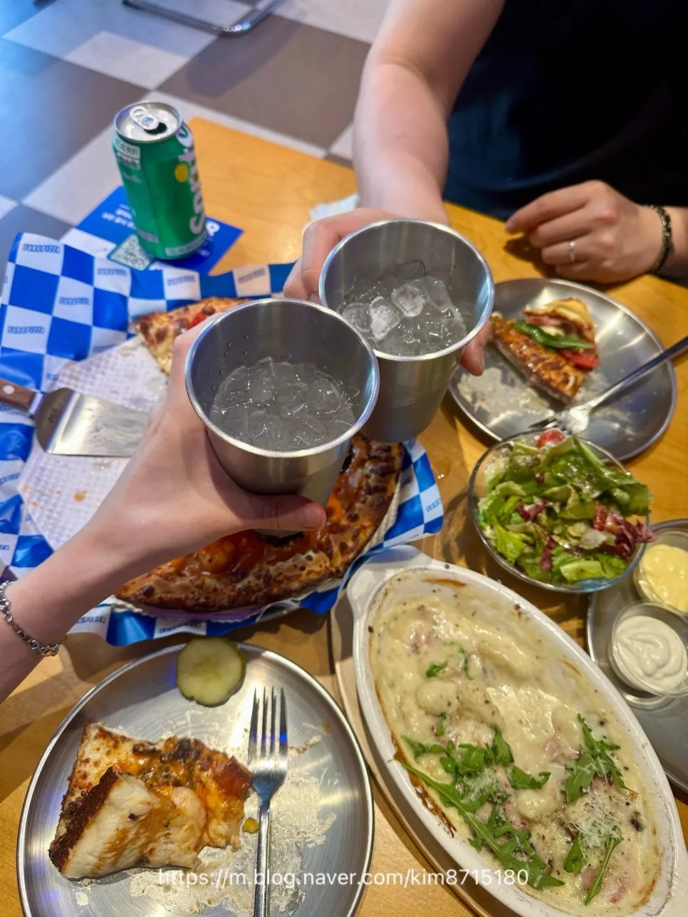 Table with pizza and gnocchi set up for a Sillim pizza date