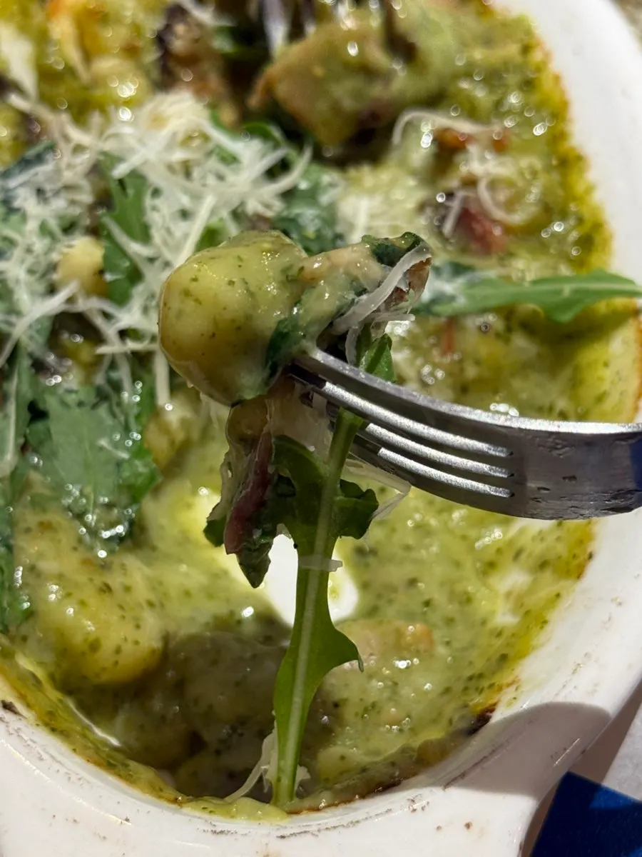 A bite of tteok-gnocchi in its oven dish