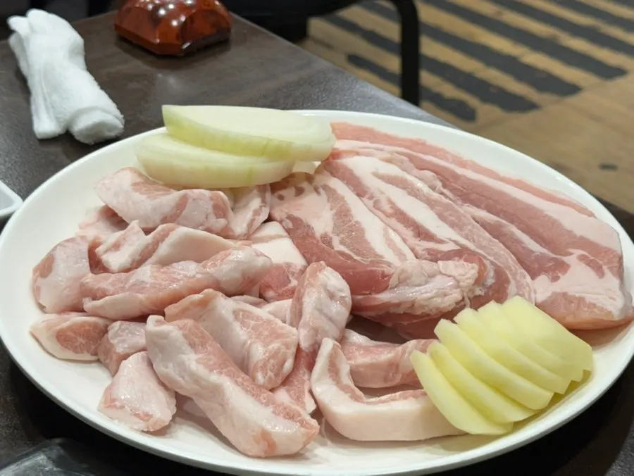Plate of thick-cut raw pork belly