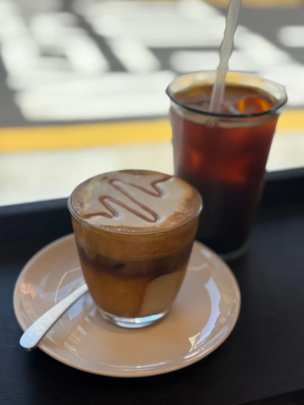 Laineschperner topped with caramel syrup over cream