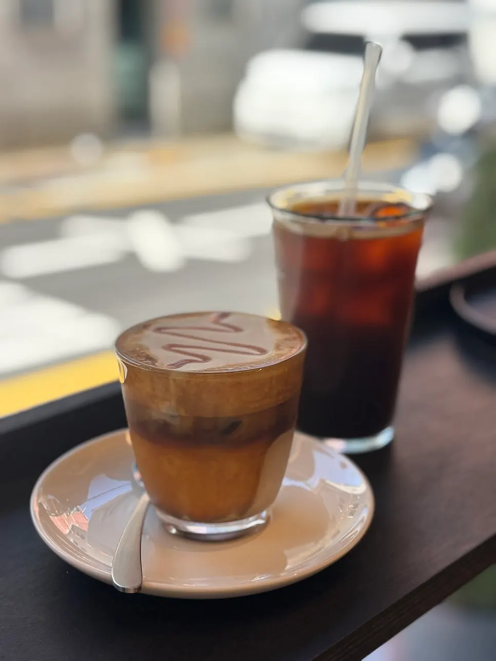 Two cups: laineschperner and iced Americano