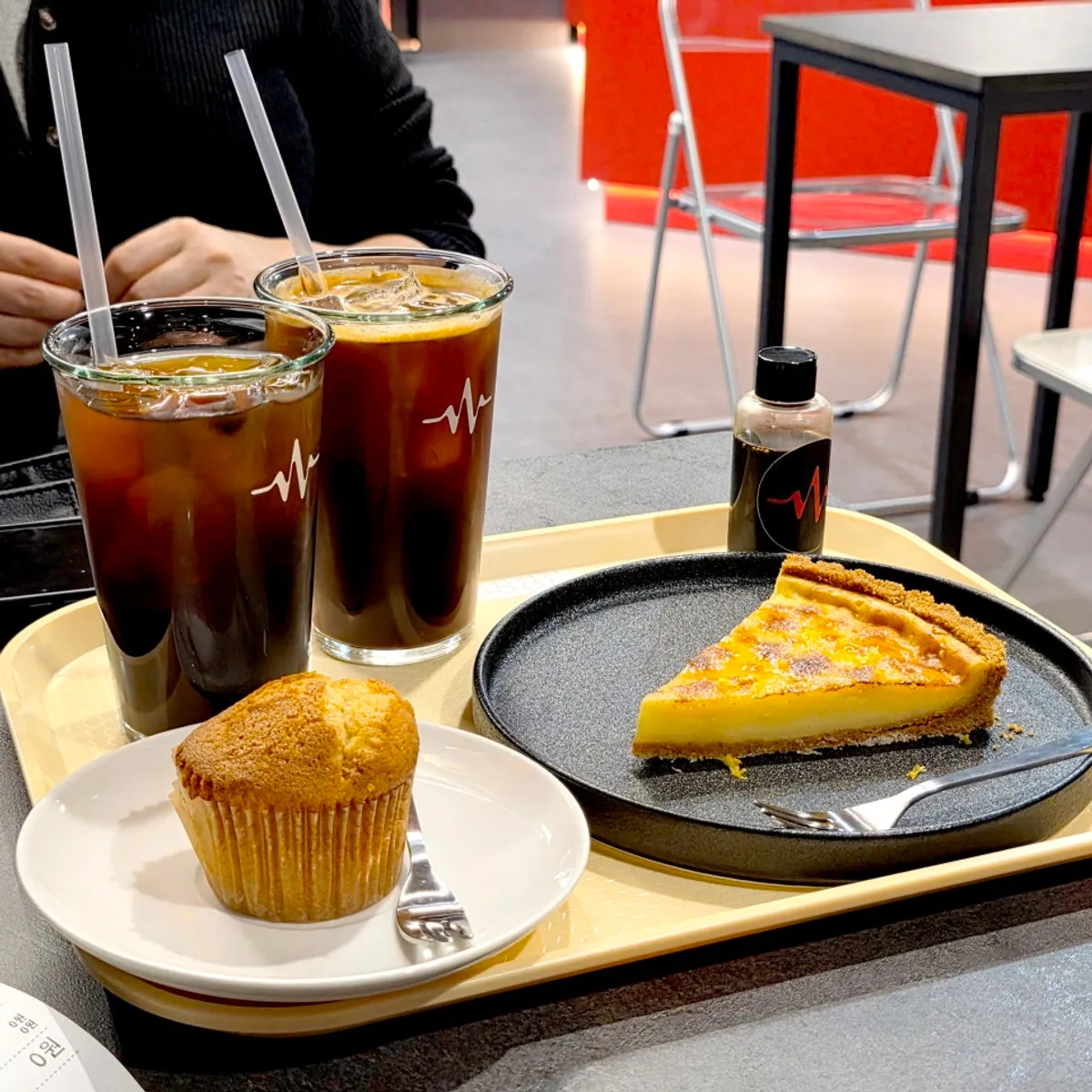 Table setting with Pulse Line Coffee's coffee and desserts