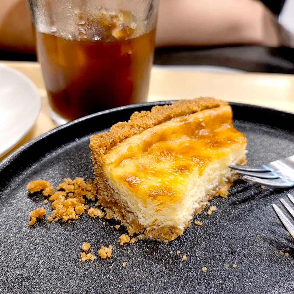 Yellow cheese muffin placed on the table with coffee