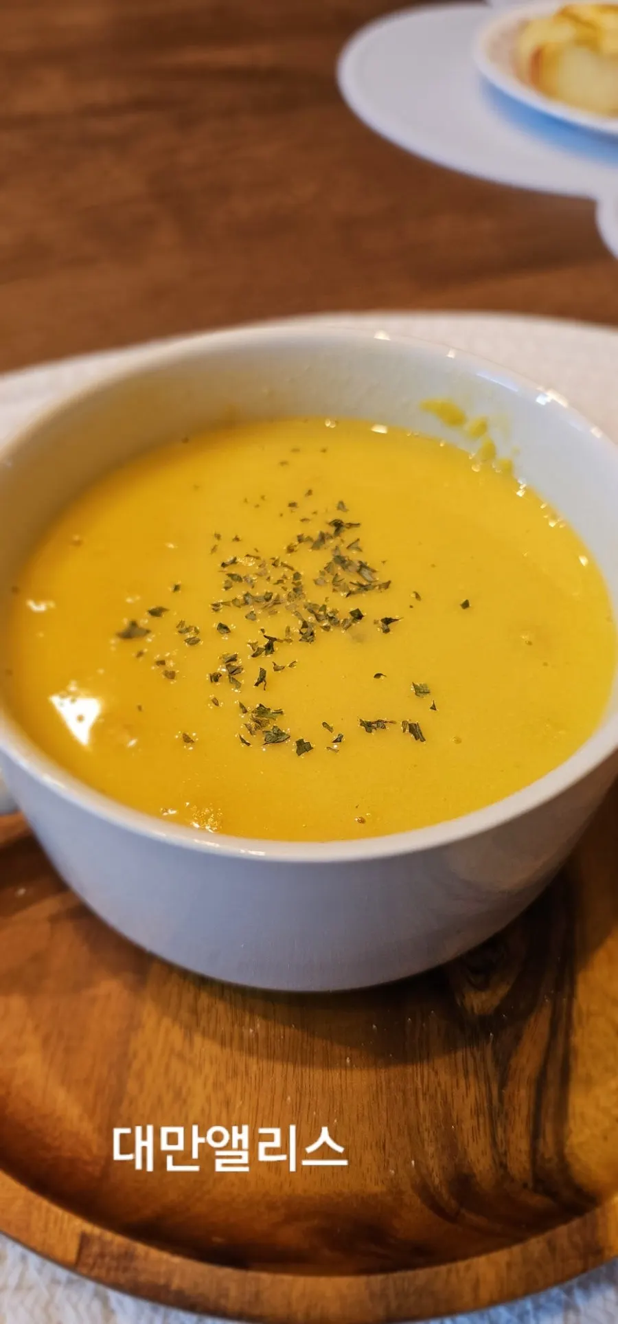 Pumpkin soup topped with basil and pepper