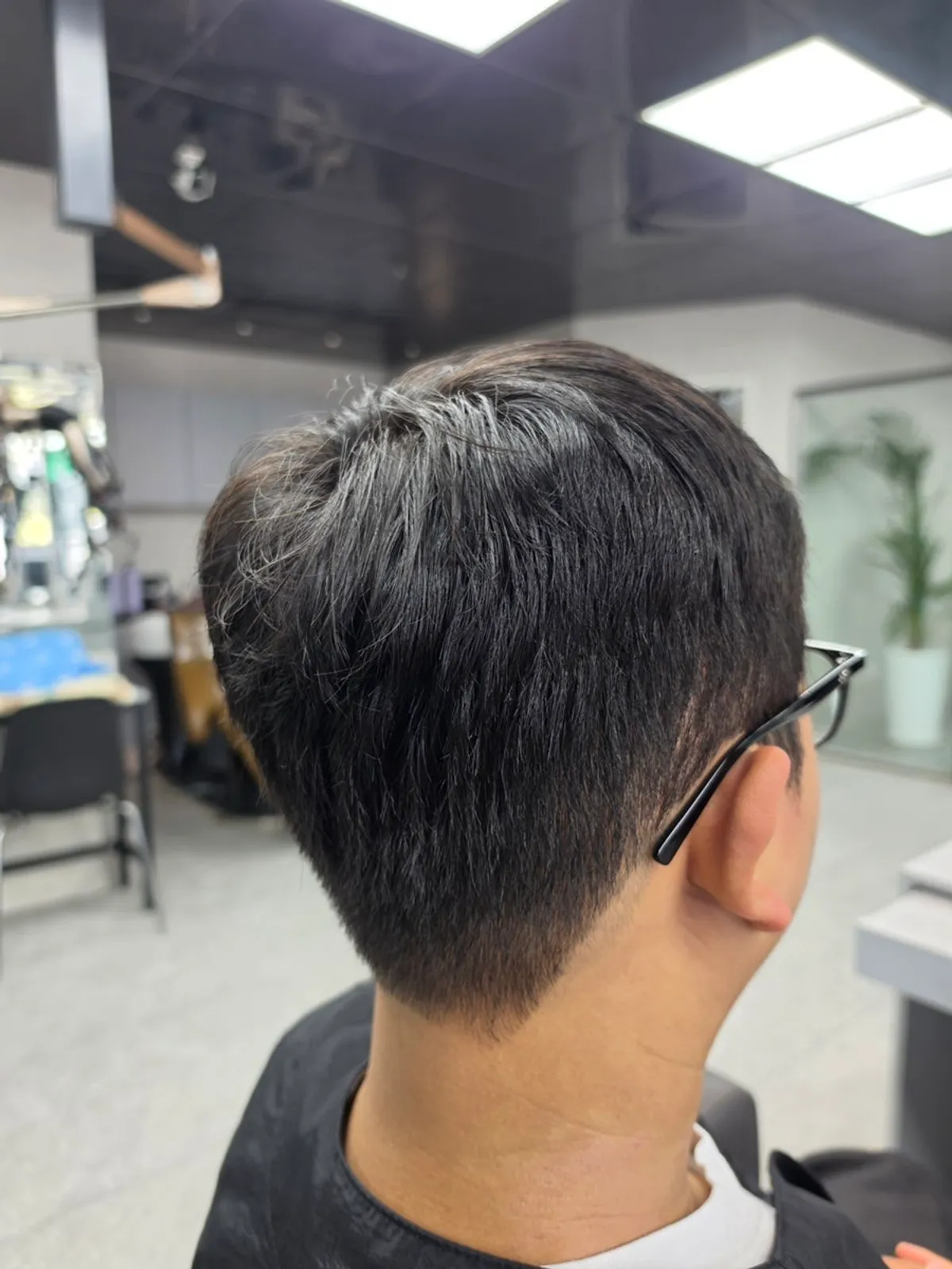 Side and back hair line tidied up by the haircut