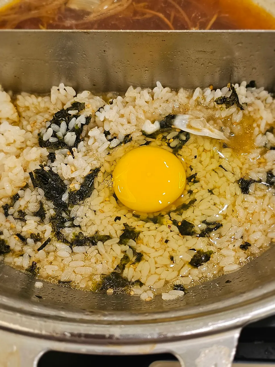 Finished porridge with egg and vegetables added