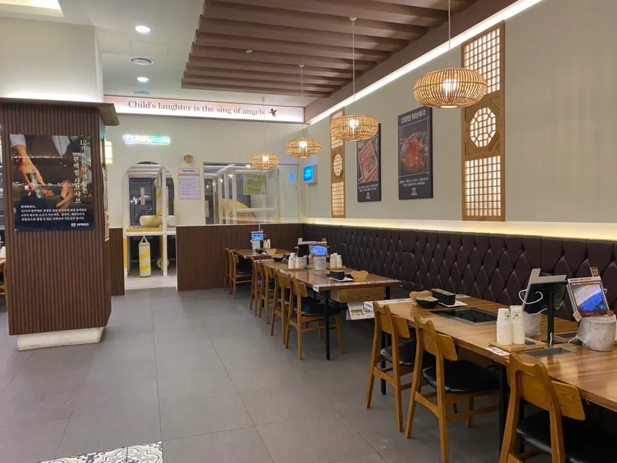 Counter and "well-being all-you-can-eat" sign at Pyeonbaek Hoegwan Dongtan Branch