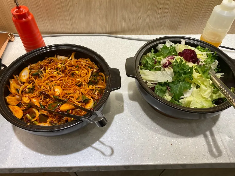 Self-serve bar corner with mukguksu and jjolmyeon