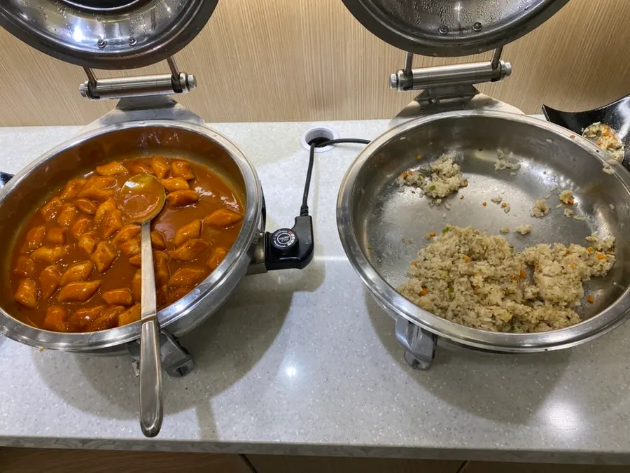 Self-serve bar tray with fried rice and spaghetti